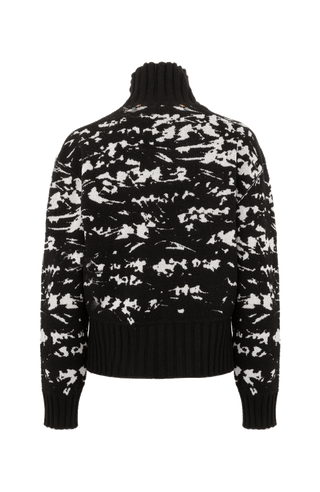 Frotteestrickpullover aus feinstem Merino Extrafine, wendbar, Jacquard Design, leicht, weich und dennoch fest, temperaturausgleichend. Bündchen und Stehragen aus Cashmere Ripstrick, seitliche Schlitze, verkürzte Passform, überschnittene Schulterpartie. In der Farbe Schwarz (Farbe: black)